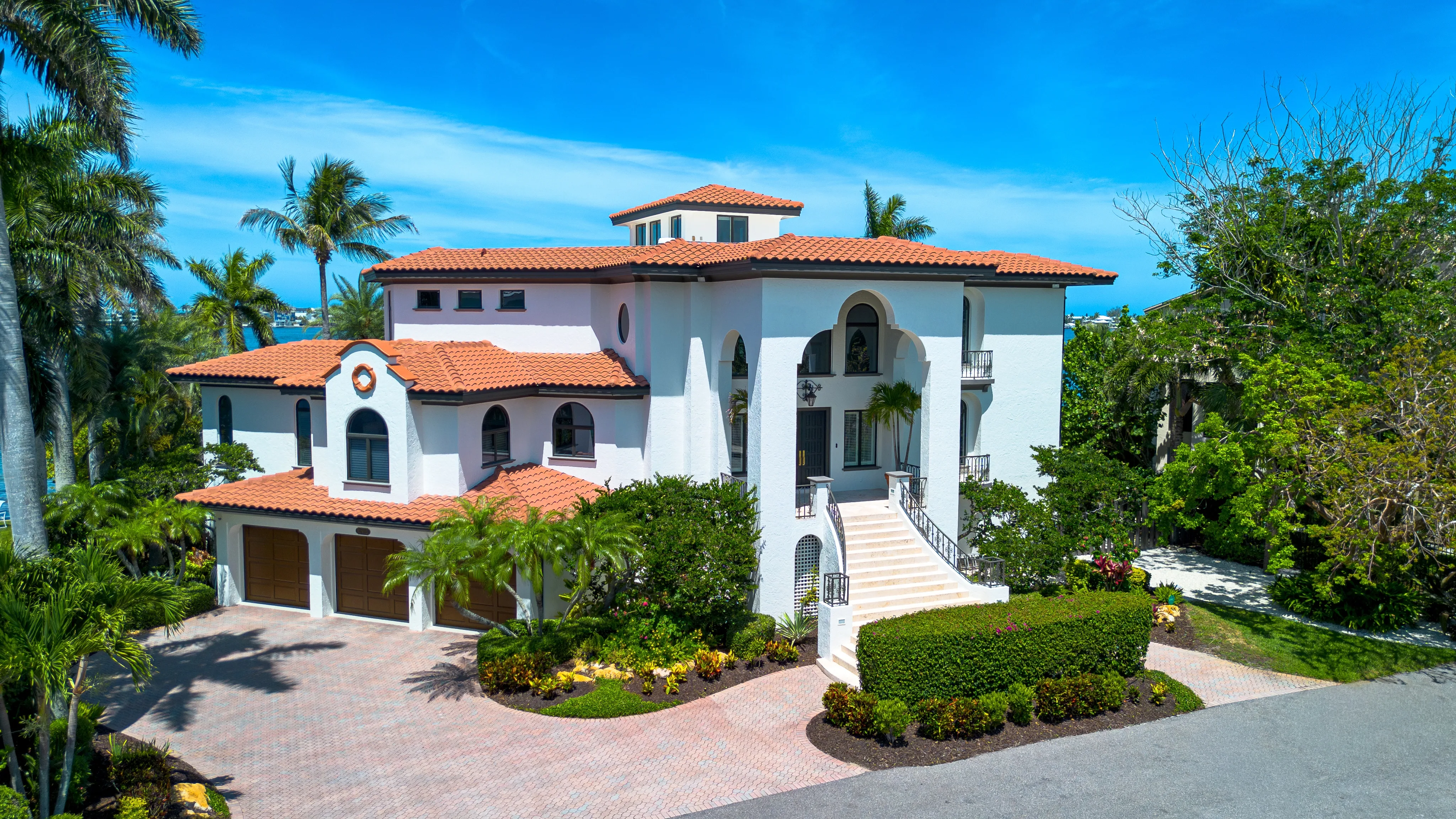 Three-bay garage and Mediterranean front facade