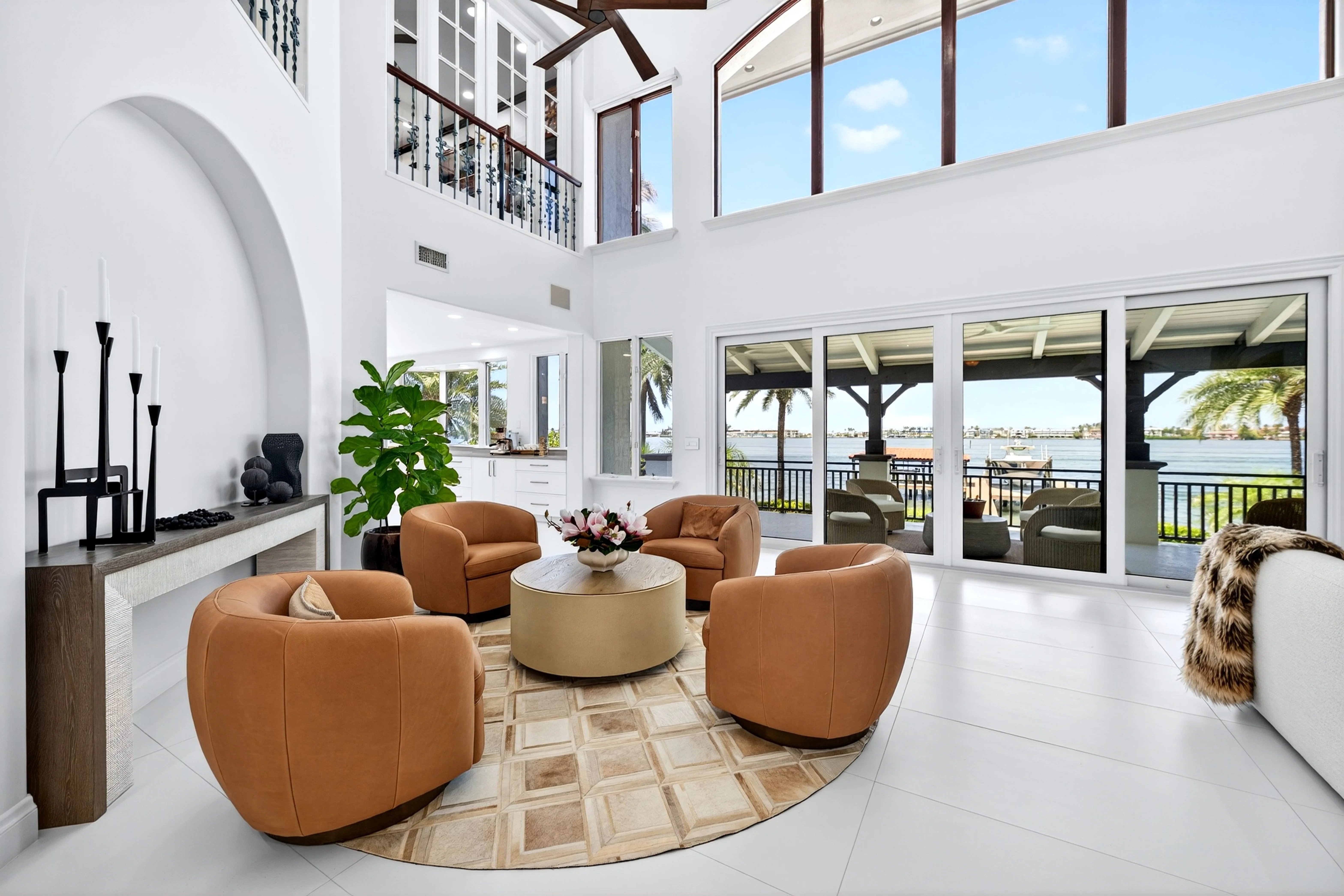 Sun-filled great room opening to sweeping views across the Sound