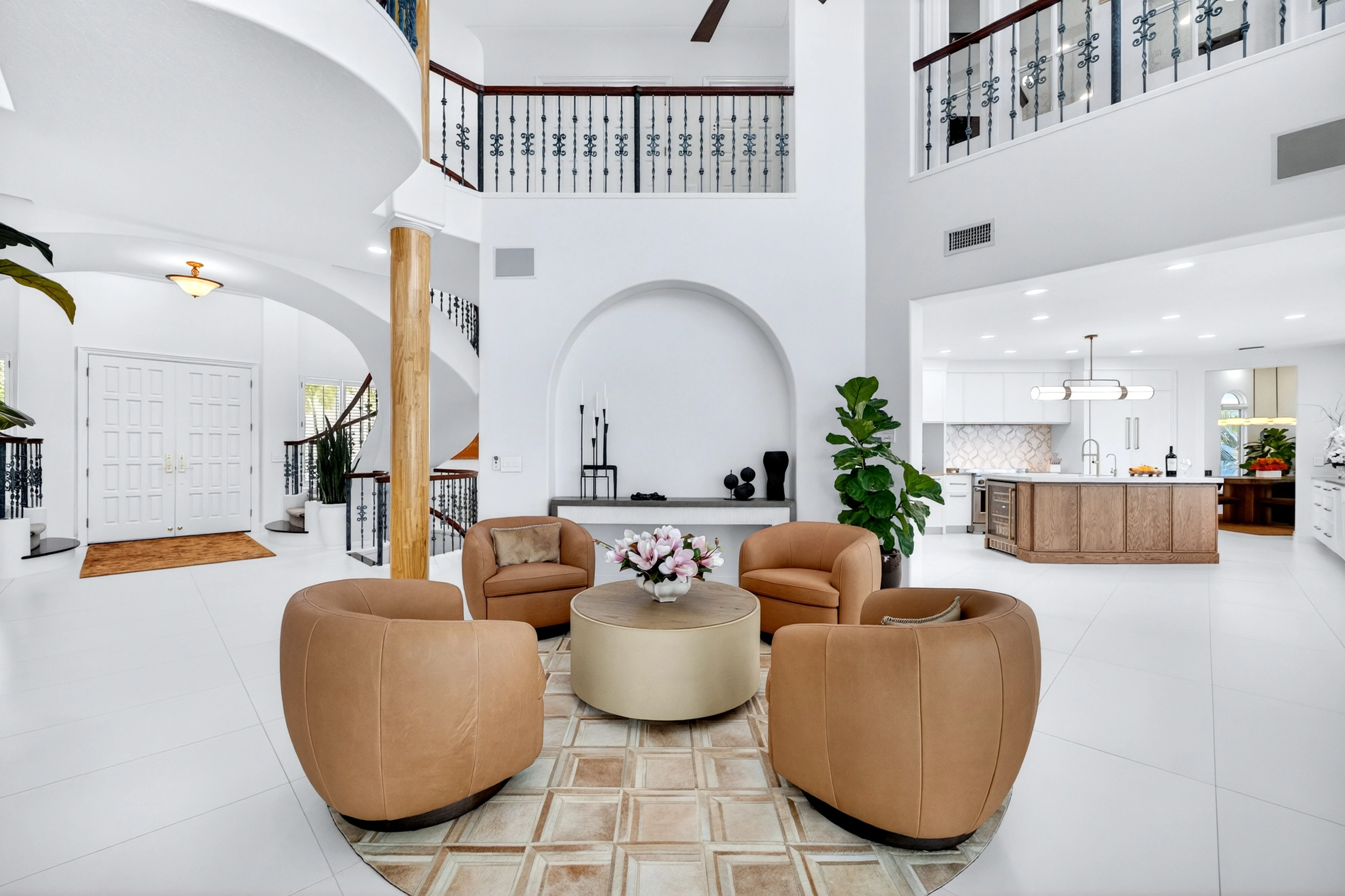 Open great room and gourmet kitchen with double-height ceiling