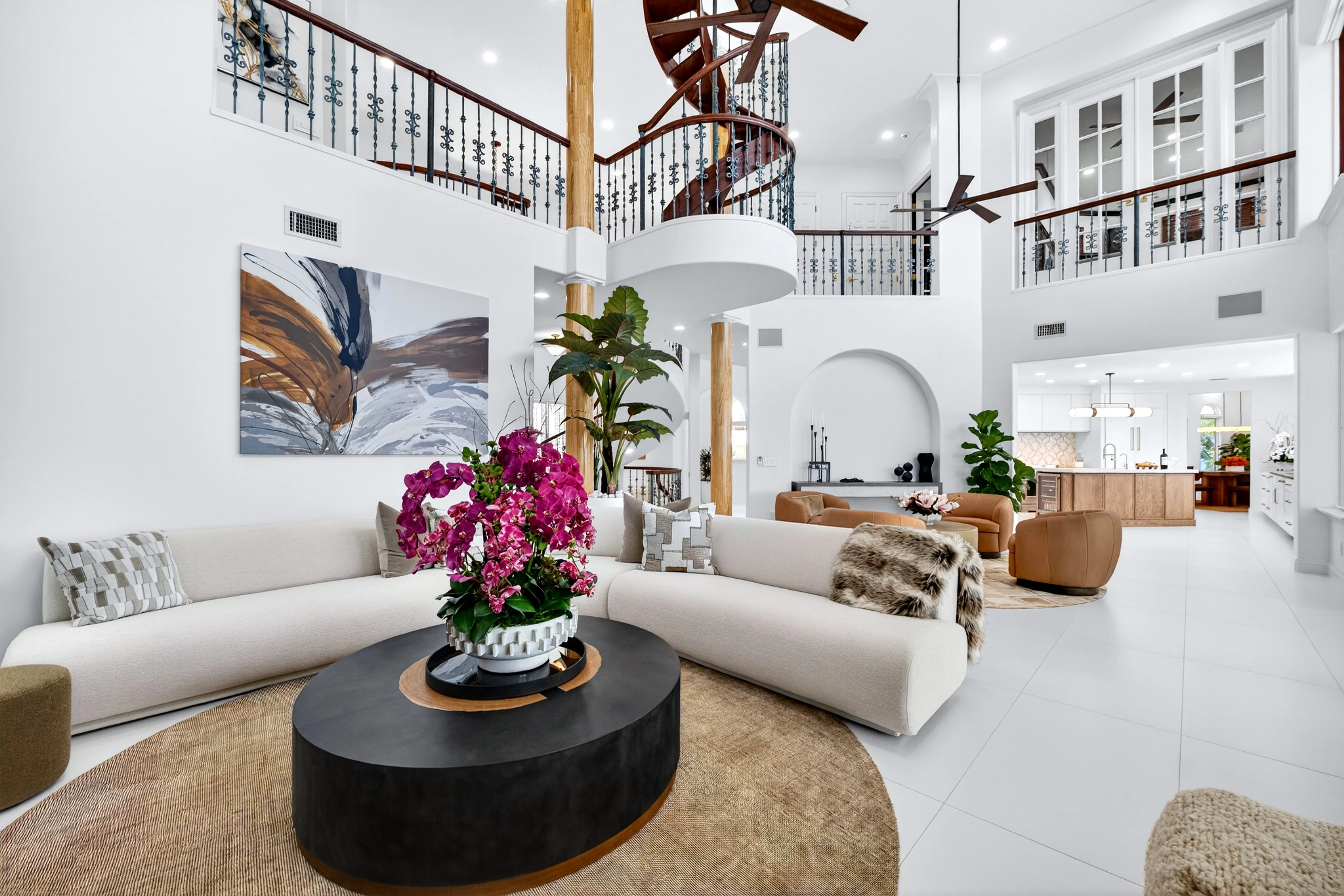 Formal living room beneath the upper-floor balcony