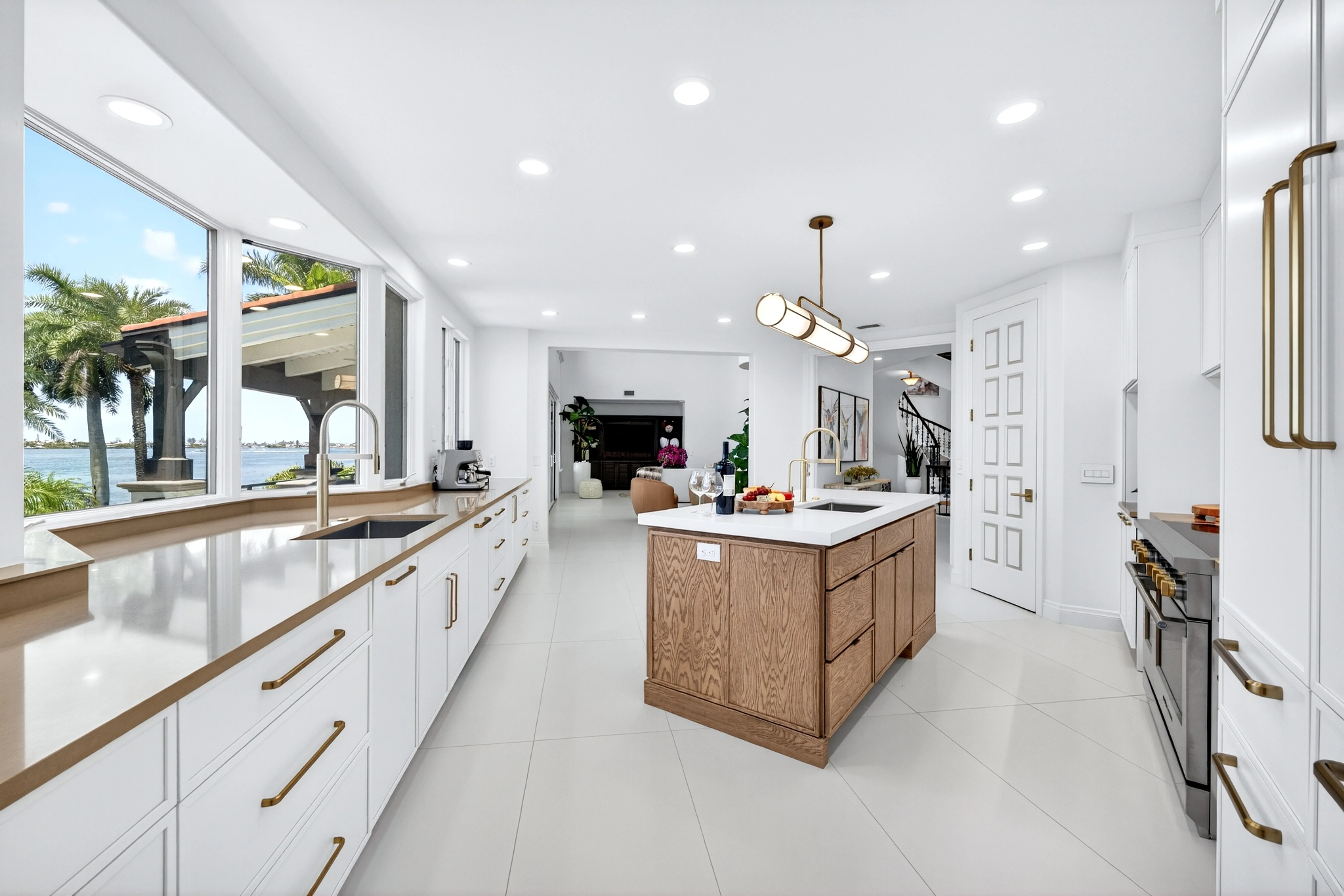 Kitchen open to the great room, with water on the left