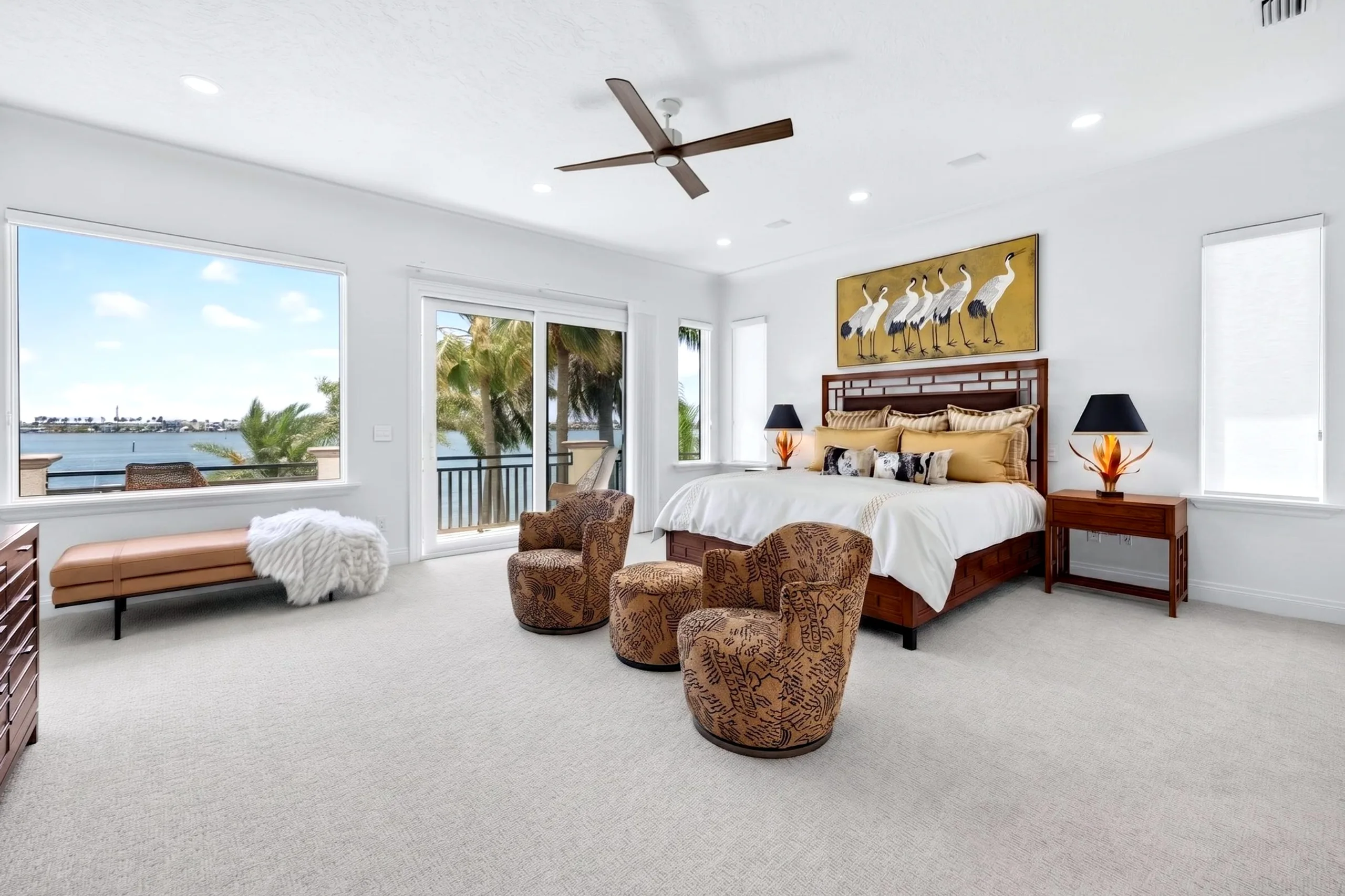 Primary bedroom with private terrace overlooking the water