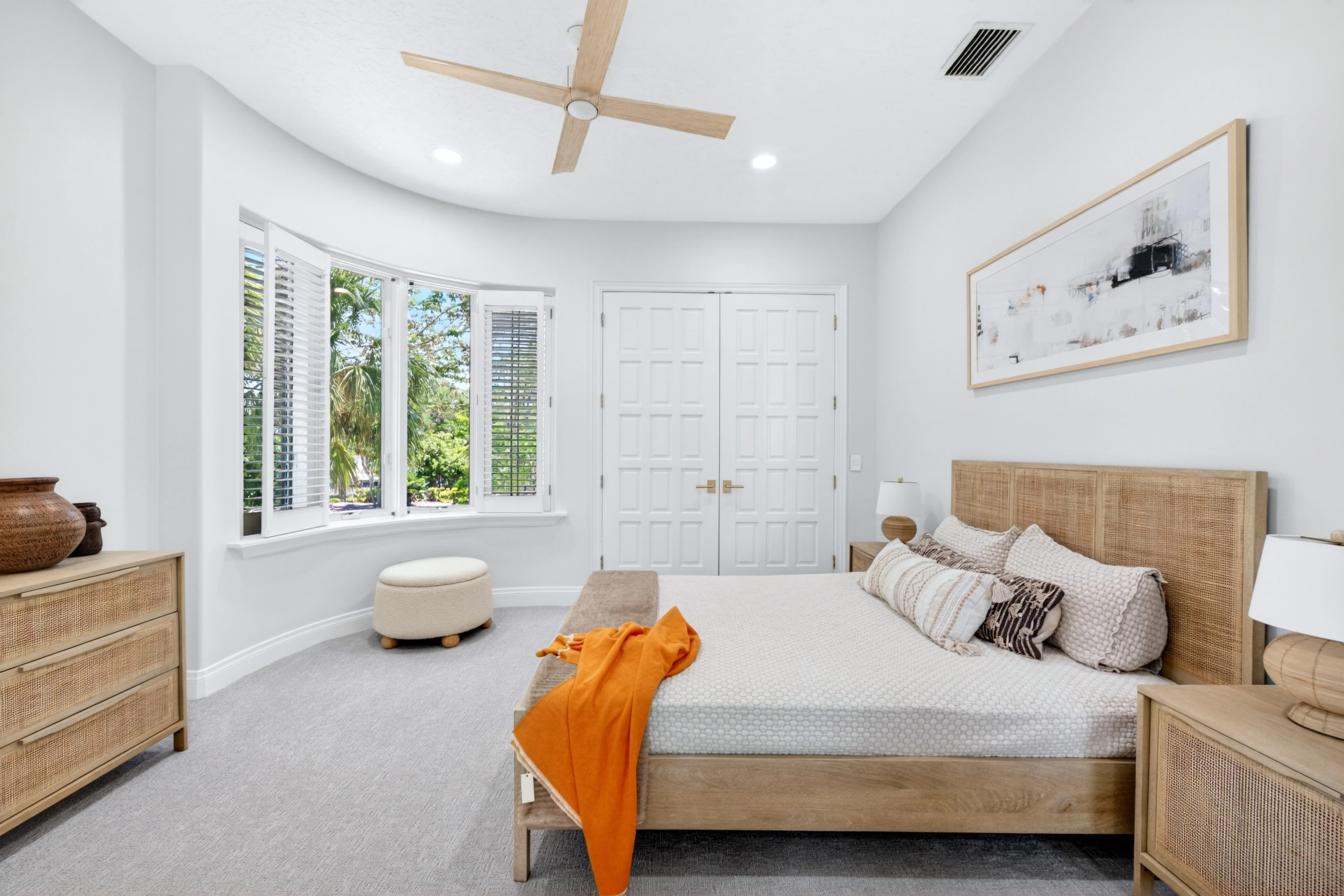Light coastal guest suite with bay window