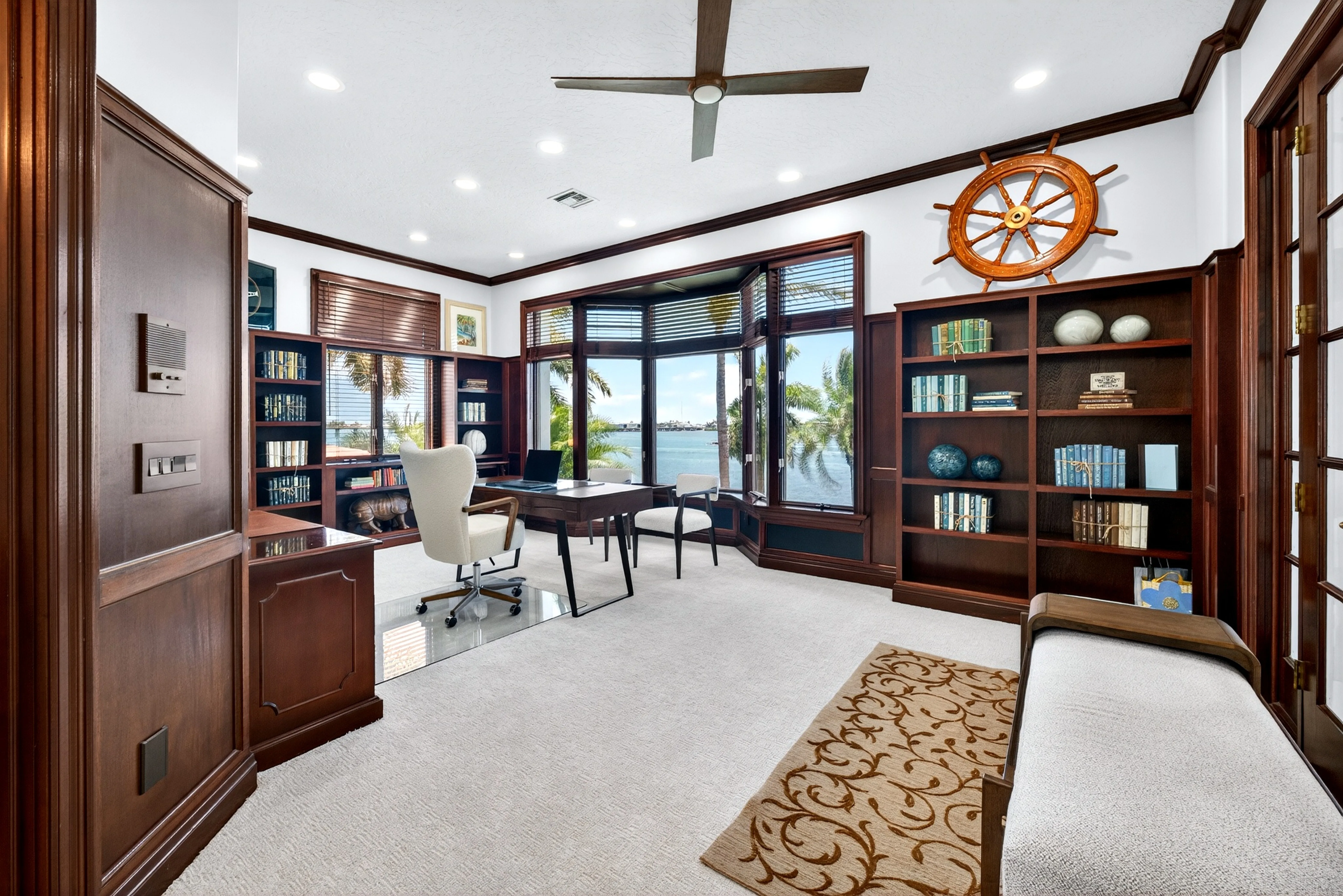 Mahogany-paneled office with bay window over the Sound